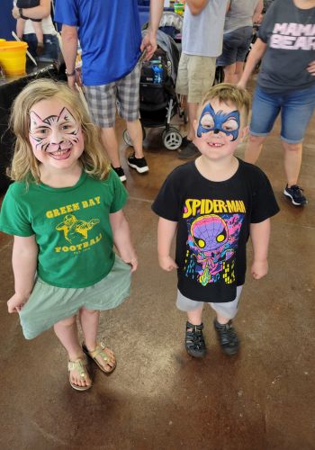 Jeanne and Axel with fun face paint.