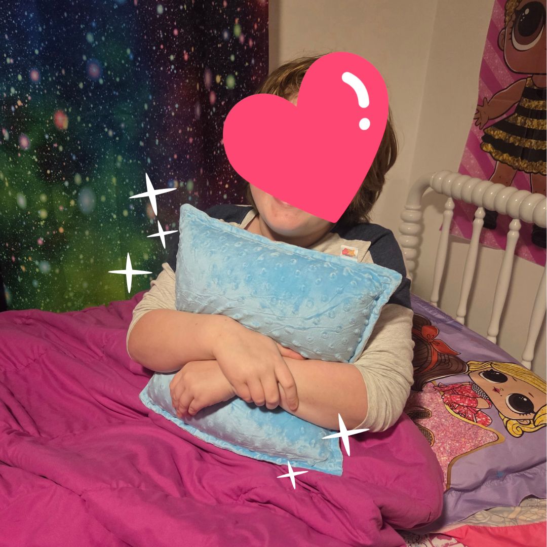 A pillow covered with soft, bumpy fabric that when hugged, it vibrates.